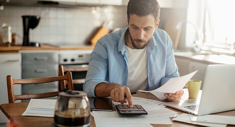 man looking at finances